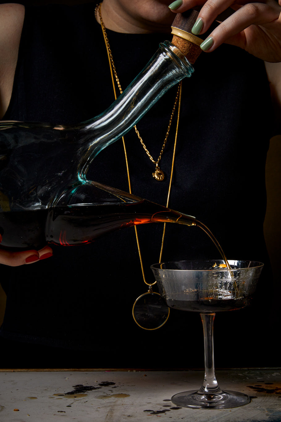 red wine pouring from porron into fizzio glass