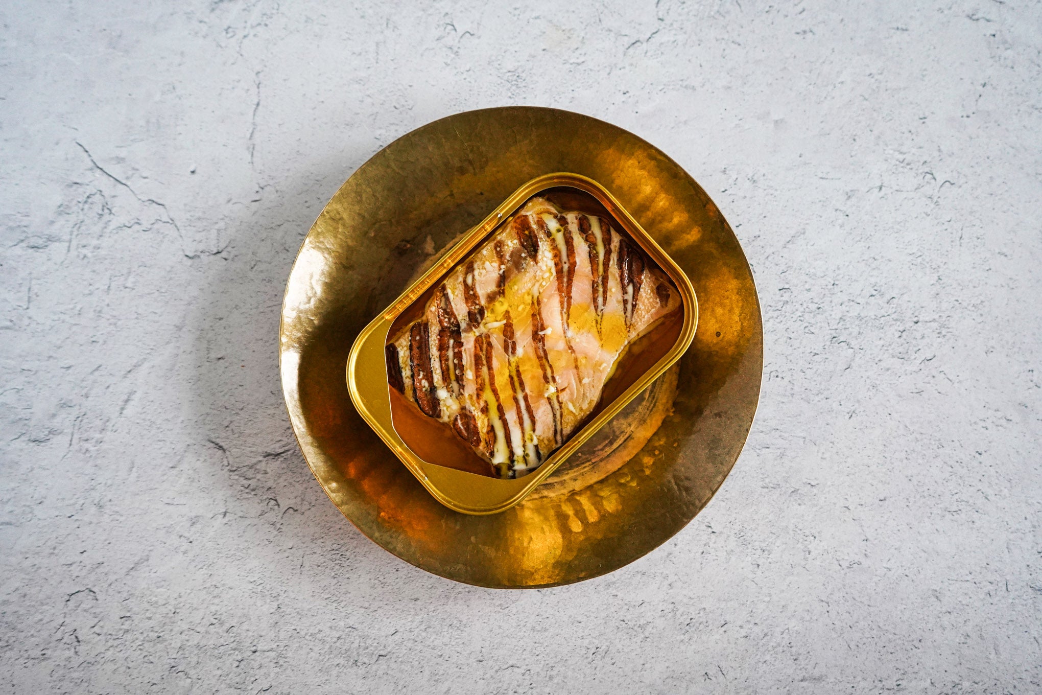Fangst Faroe Islands Salmon flash grilled in cold pressed rapeseed oil open can on brass plate