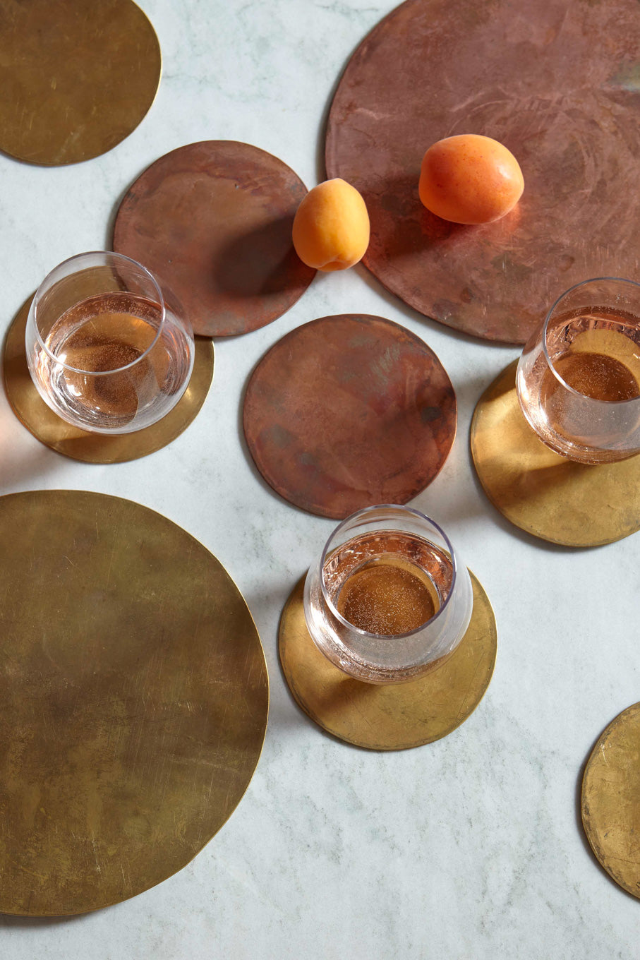 Brass trivet and brass coasters with three glasses